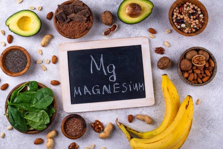 Blackboard with Magnesium surrounded by food