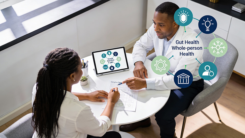 Doctor and patient at table discussing gut health