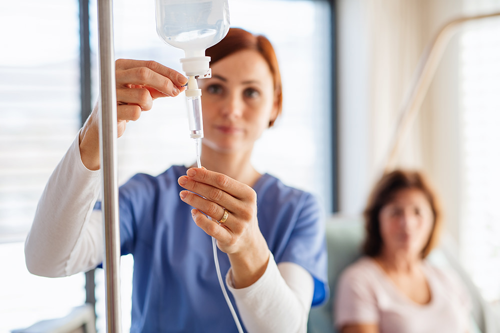 Nurse checking IV